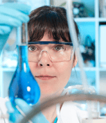 cropped Unmasked lab worker examining solution